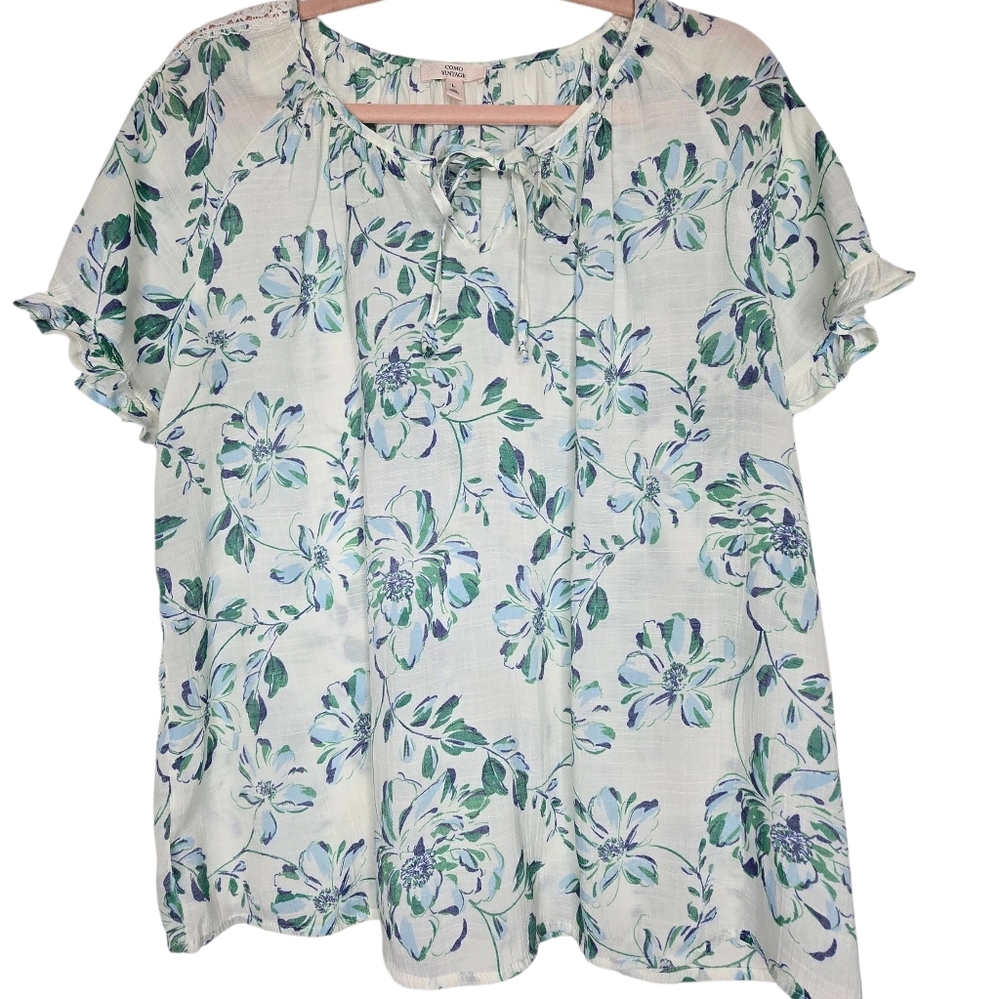Como Vintage brand blouse features a romantic white,blue, and green floral print